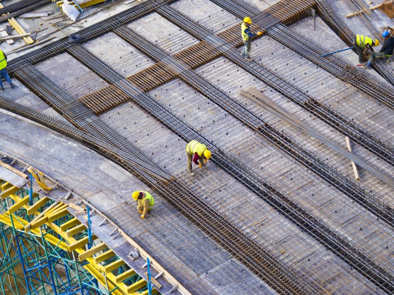 workers-putting-metal-structure-construction